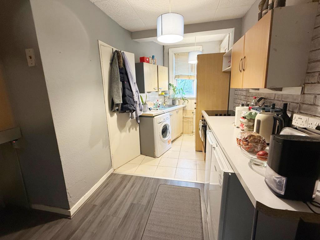 Lot: 68 - STUDIO FLAT FOR INVESTMENT - Kitchen area with door to shower room and door to rear